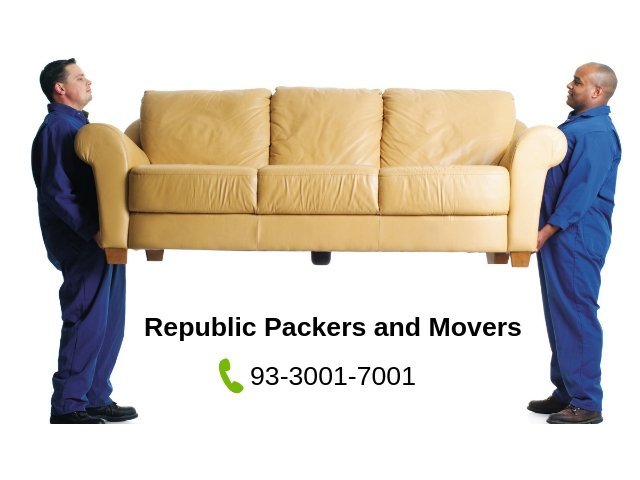Two guys lifting sofa for relocation